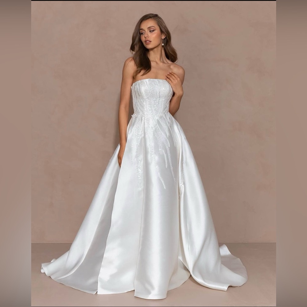 Brand new unaltered and unworn wedding dress